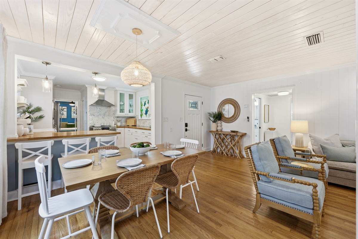Bright coastal dining space with open flow into the kitchen - made for gathering