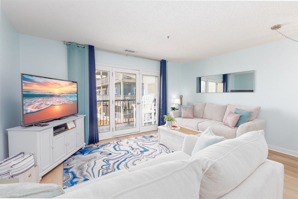 Coastal elegance meets modern comfort in this inviting living area.