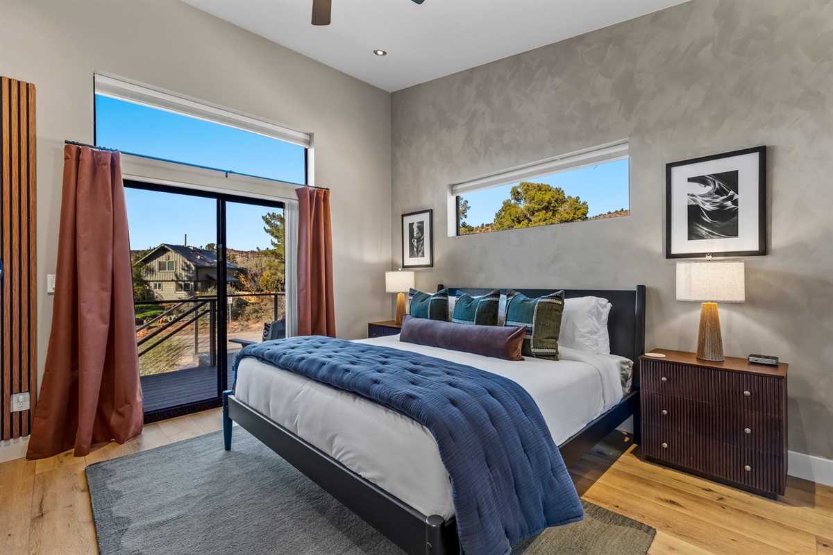 A comfortable second bedroom with a cozy king bed, natural light, and a calm design - ideal for couples, friends, or additional guests.