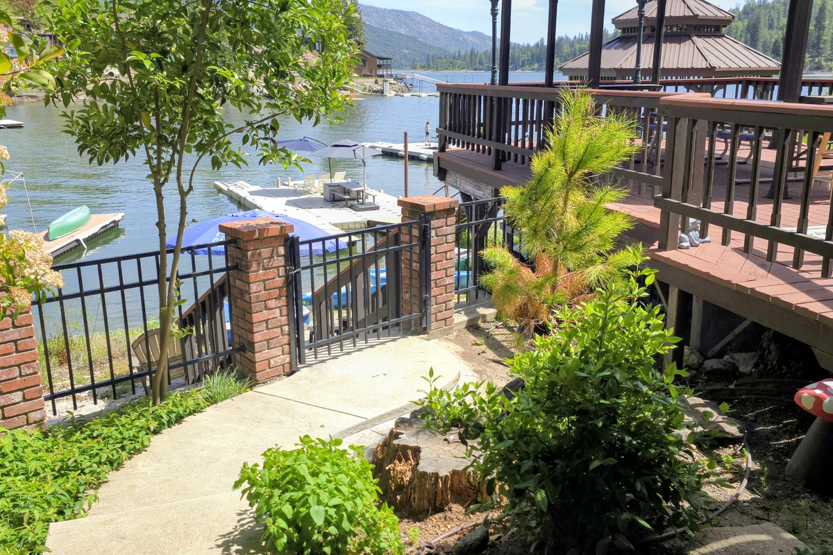 Walkway from the bottom floor dining to the gate leads to the sandy beach & toys