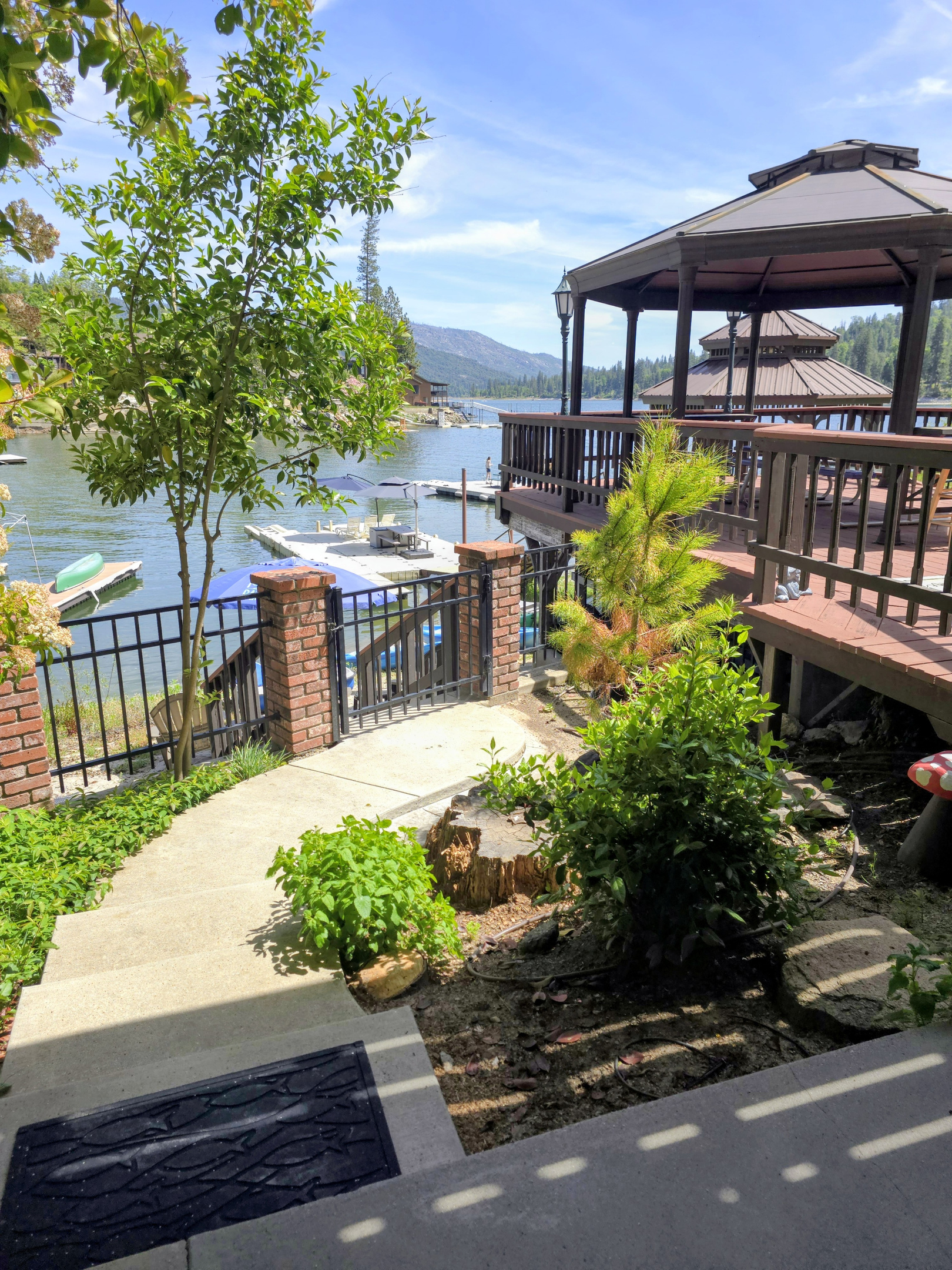 Walkway from the bottom floor dining to the gate leads to the sandy beach & toys
