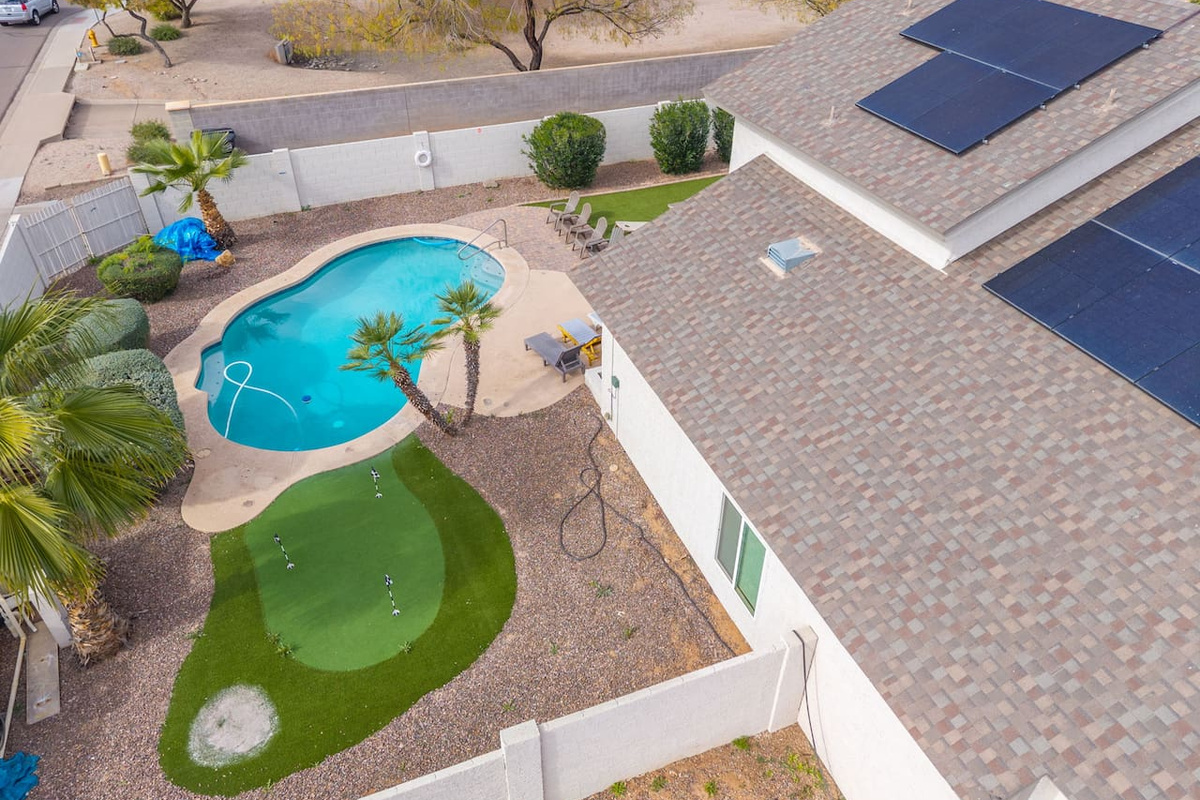 A sparkling pool paired with a resort-worthy backyard escape.
