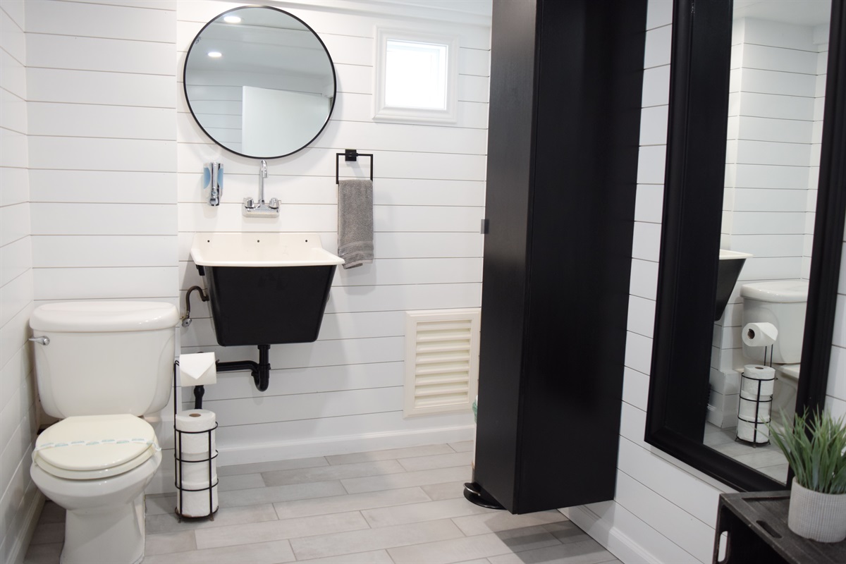 Finished half bath adjacent to downstairs bedroom