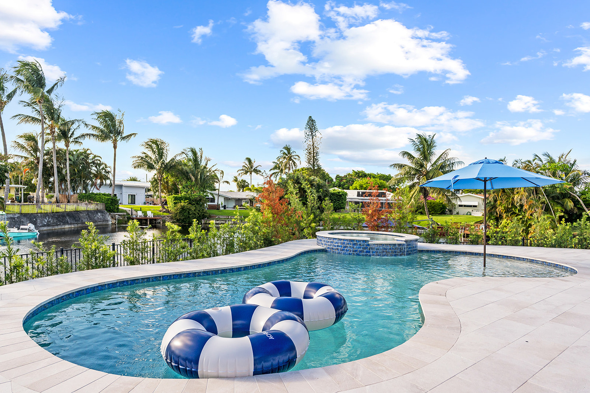 Take a refreshing dip in the heated pool while enjoying tranquil canal views and tropical landscaping.