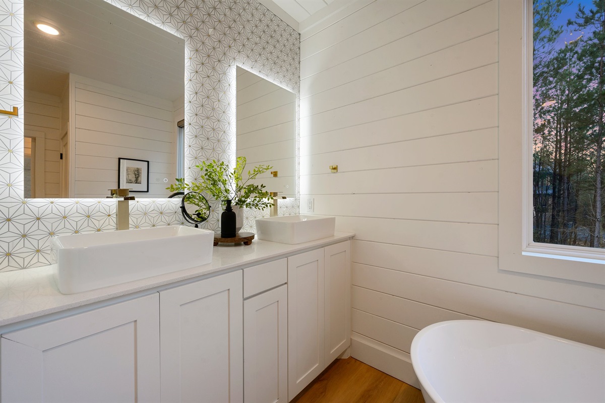 Soft lighting and elegant finishes create a bright, serene atmosphere.