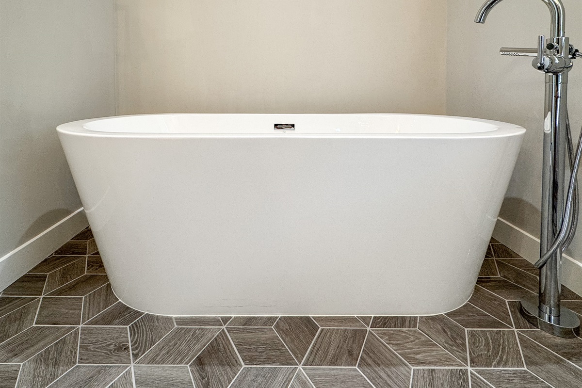 Soaking tub in primary bathroom.
