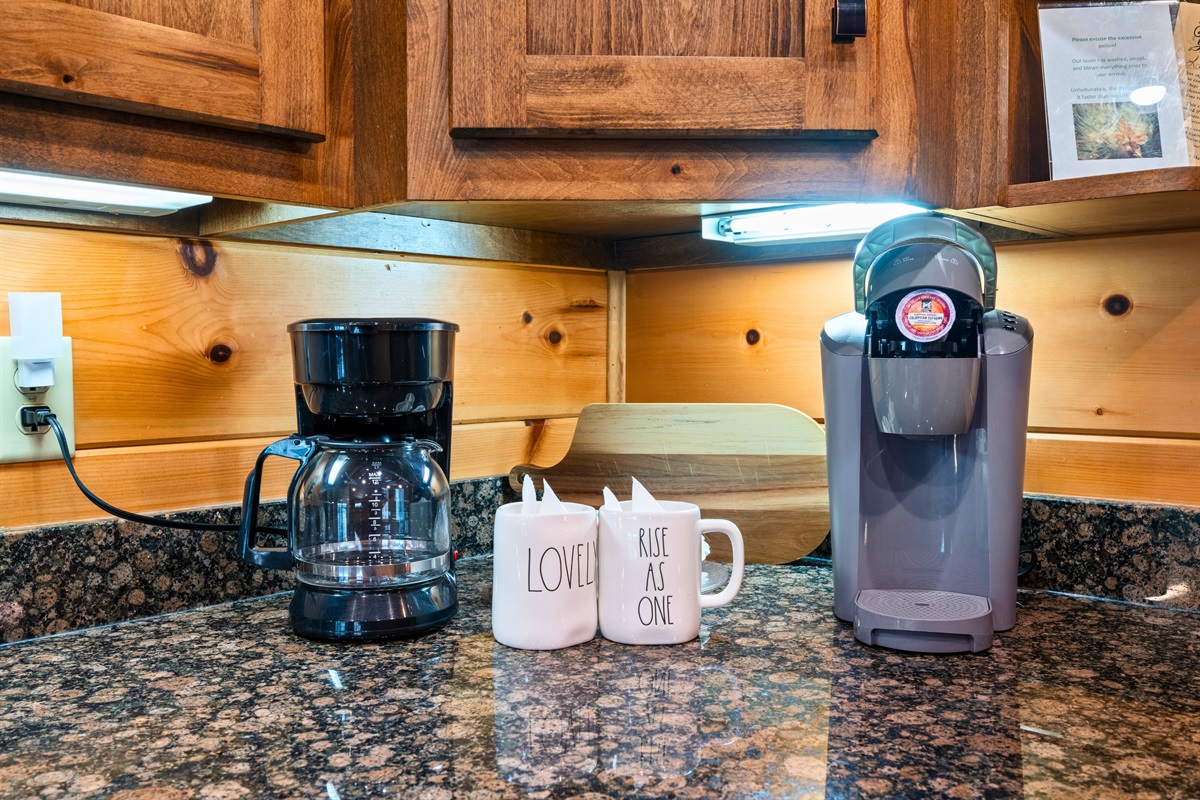 Coffee station complete with drip and Keurig brewers for morning convenience.