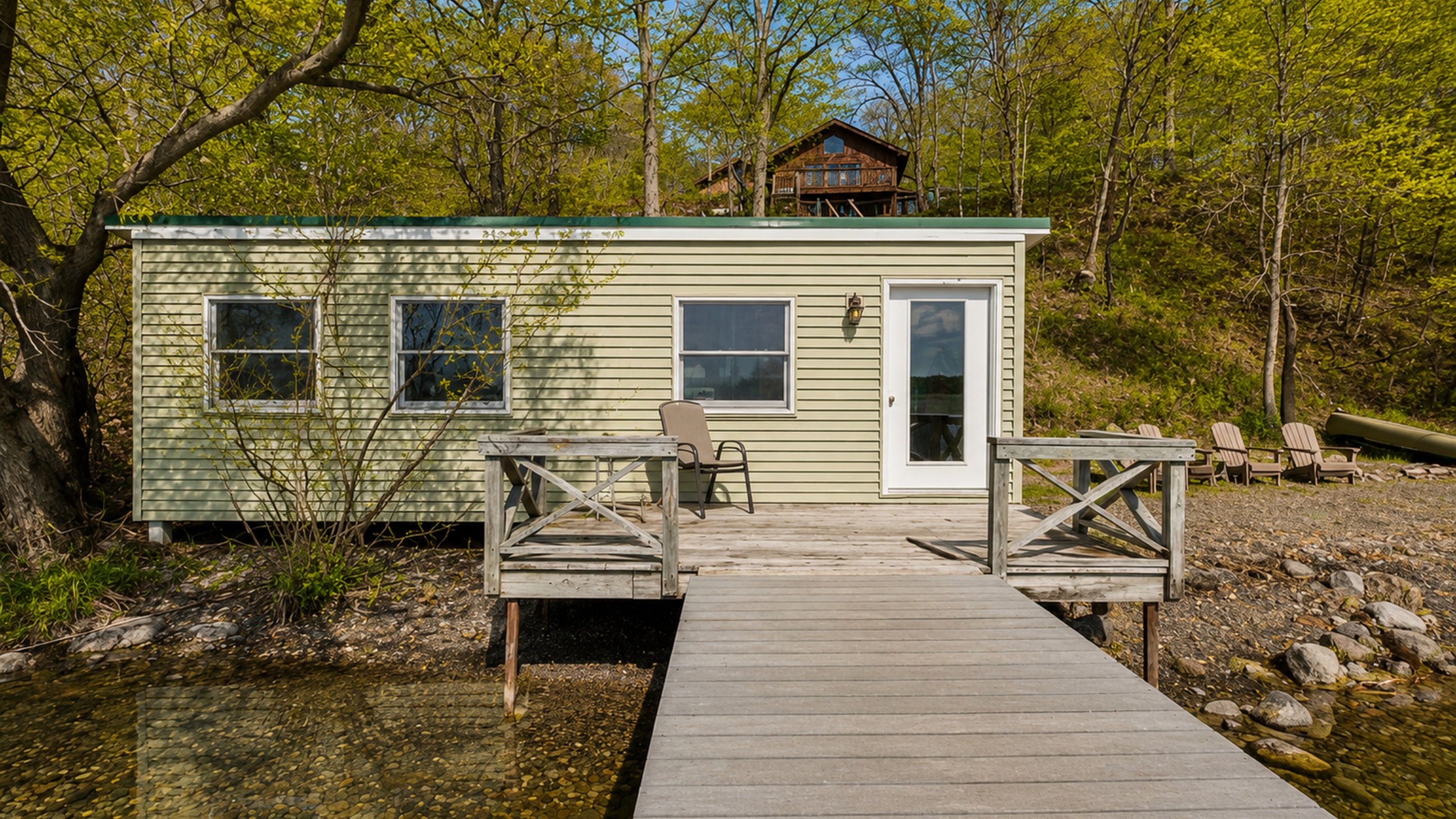 Lakefront / Boathouse / Dock (requires three flights of stairs to access) -  Enjoy direct lake access from this cozy lakeside cabin, complete with a private deck for relaxing by the water. Ideal for a serene, natural escape.