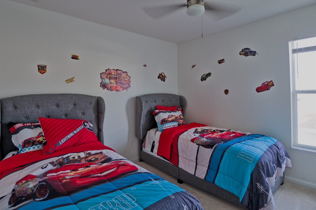 Cars room with two twin beds.