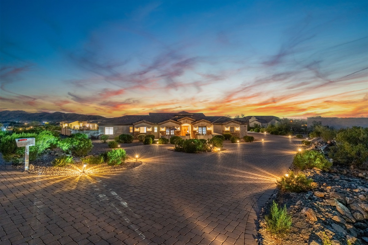 Twinkling lights and mountain silhouettes—pure tranquility at nightfall.