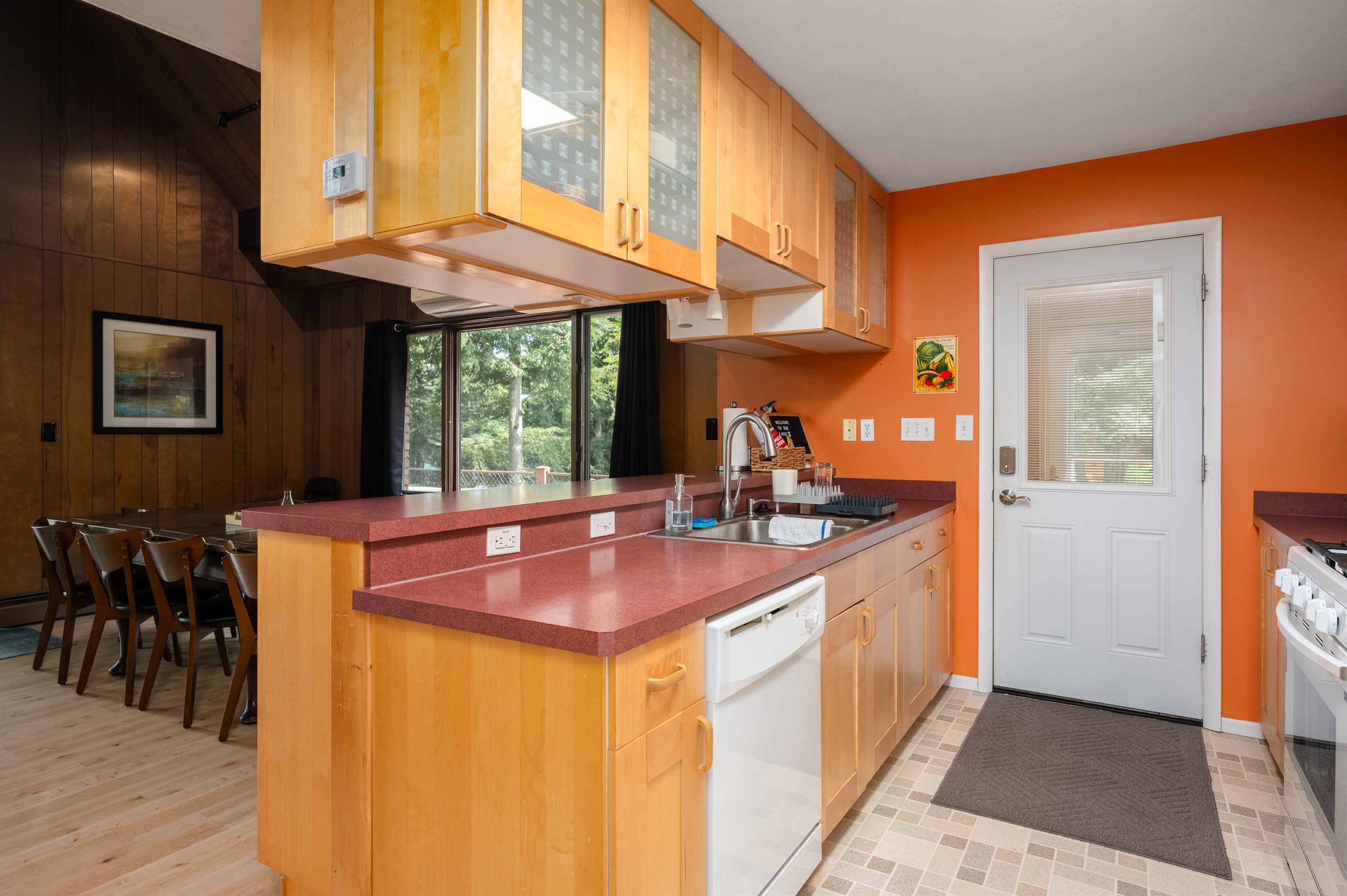 Kitchen with wood cabinetry and appliances