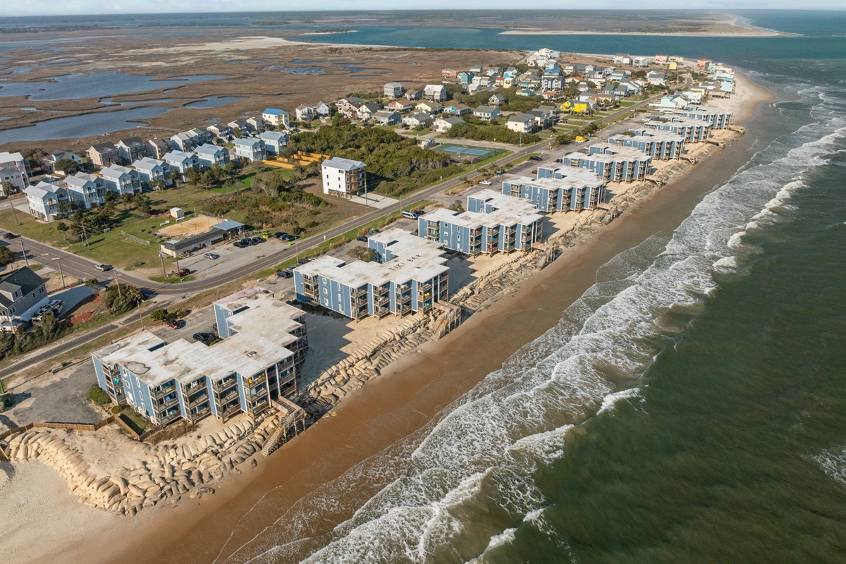 Wide aerial view highlighting the North Topsail Beach coastline and surrounding coastal community, looking north