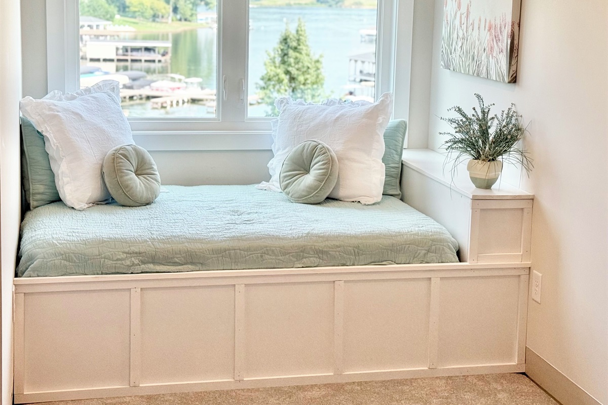 This full size window bed is adorable! The lake views are spectacular! It can also serve as such a cute reading nook. this extra bed is a game changer for parents!