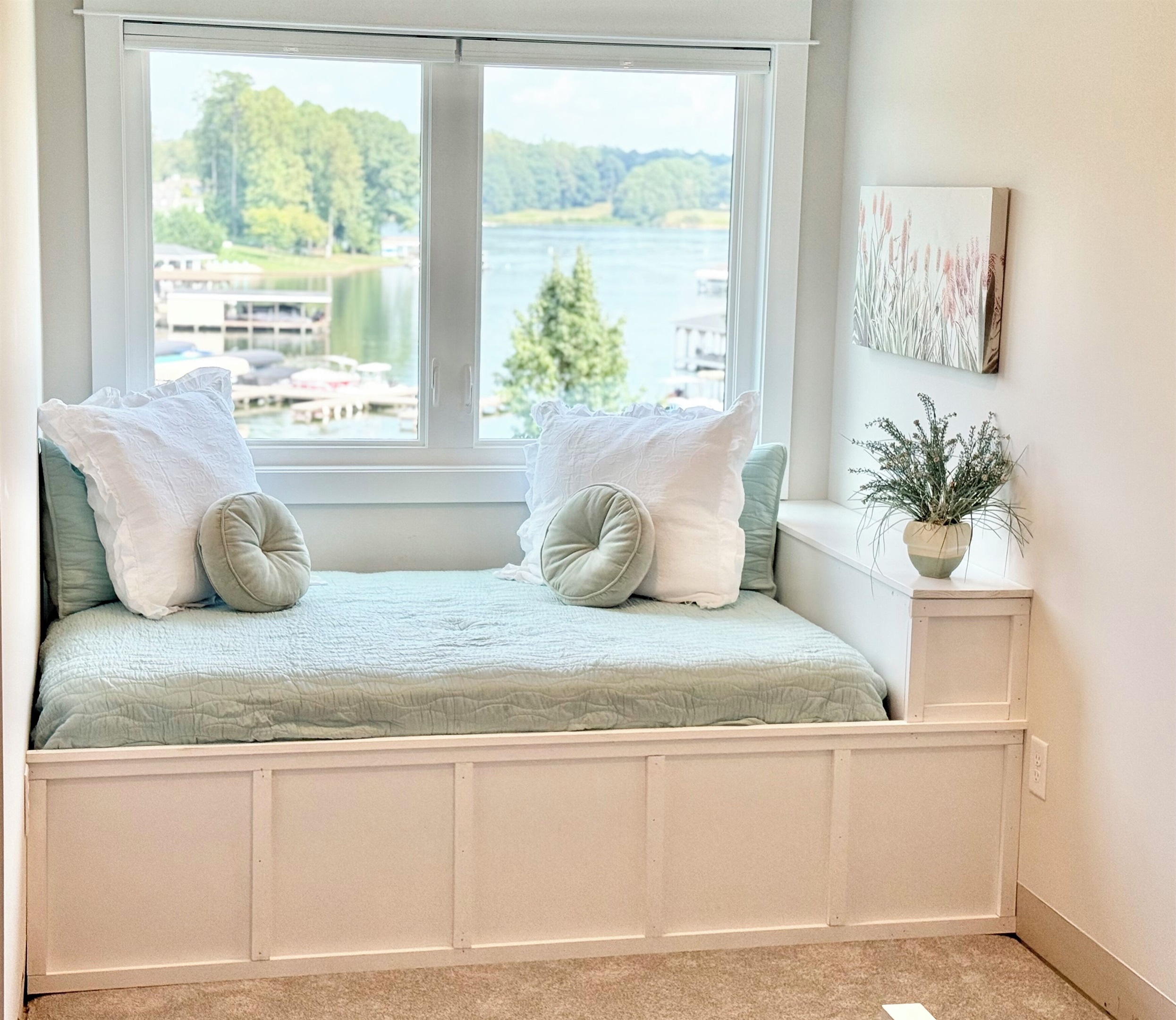 This full size window bed is adorable! The lake views are spectacular! It can also serve as such a cute reading nook. this extra bed is a game changer for parents!
