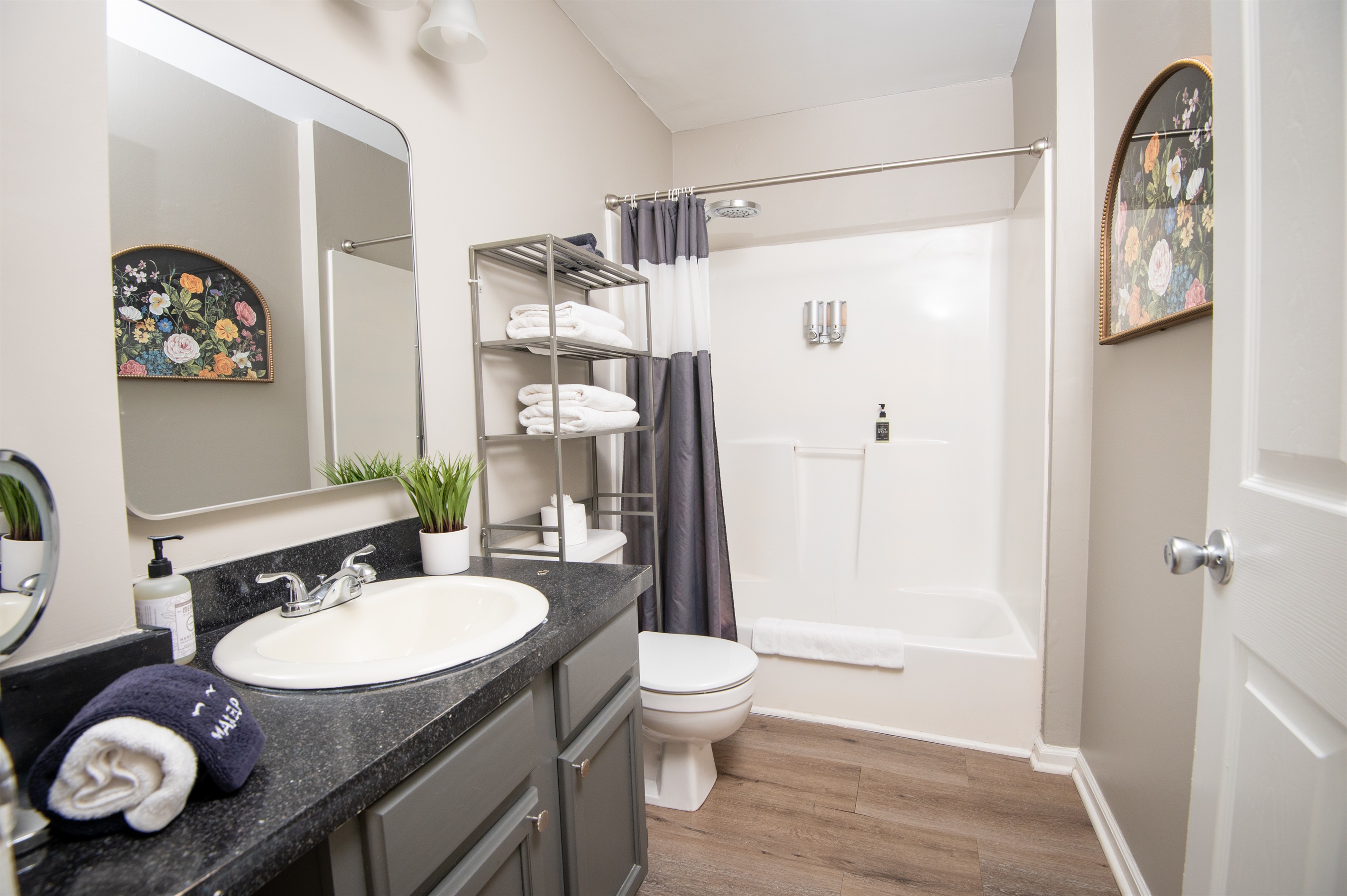 Here is your first full-sized bathroom located in the hallway. Bath and shower mix! Bring your favorite bubble bath! Both bathrooms come complete with shampoo, body wash, conditioner, hand soap, and all the linens you need for a comfy stay.