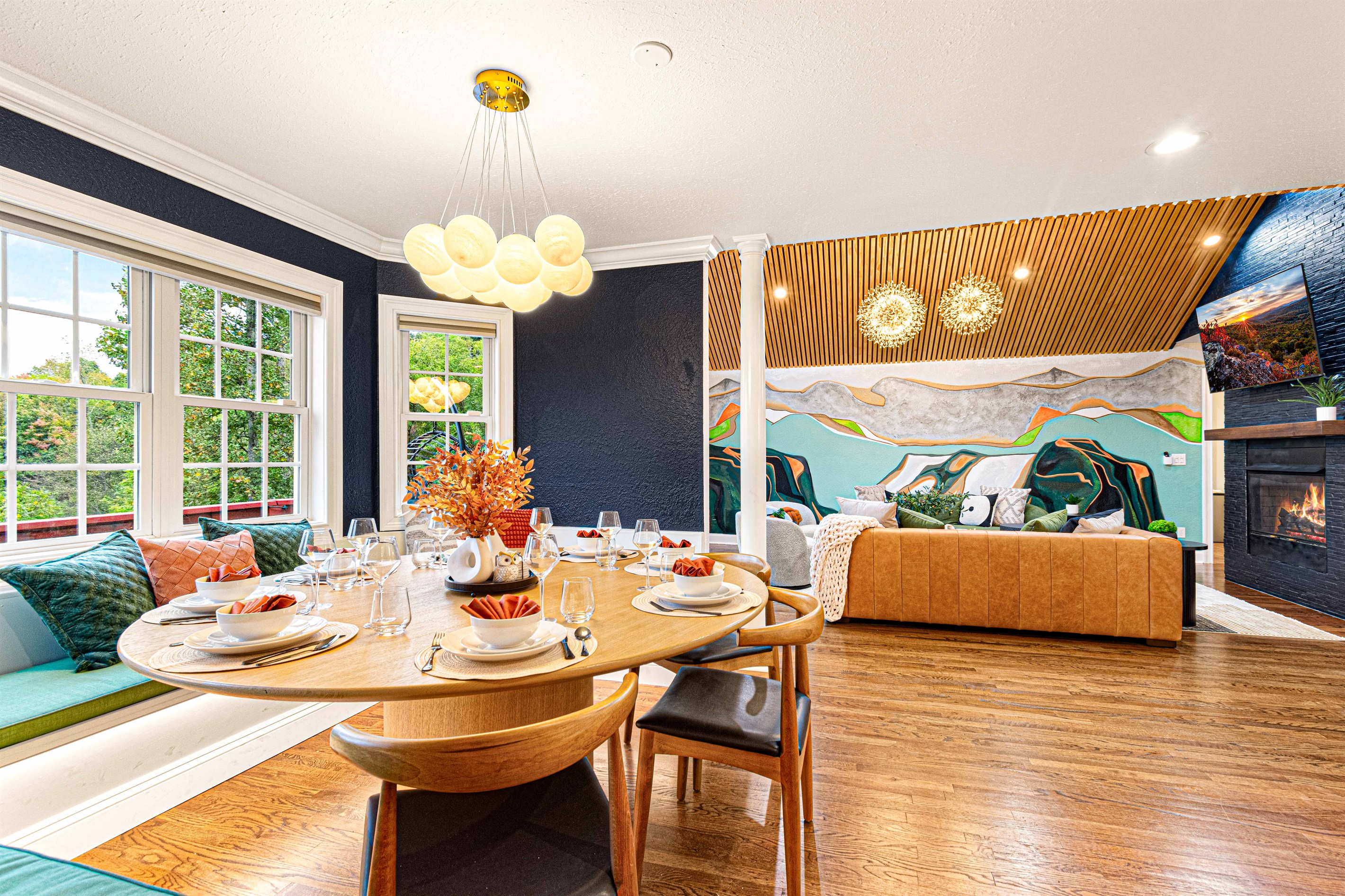 Seamless flow from the dining area to the living room, where modern design meets artistic flair for an inviting and stylish space.