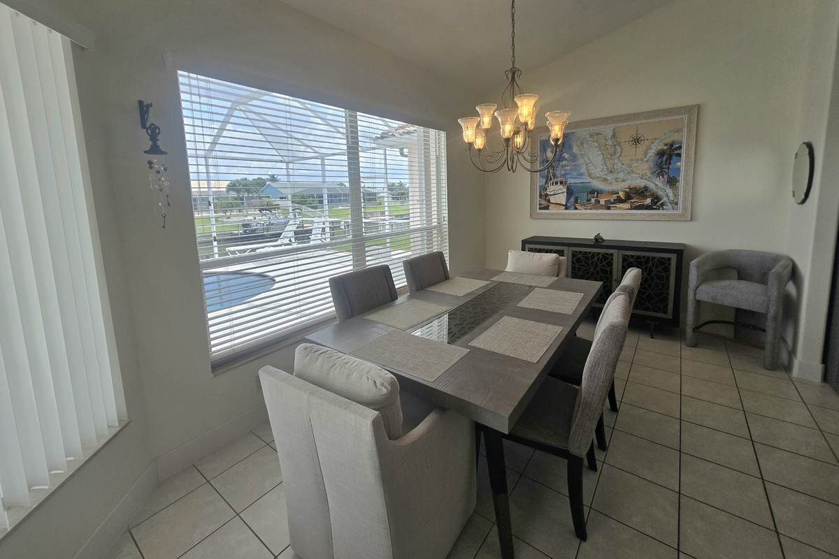 Dining area seats up to 6, offering stunning views of the water, pool, and lanai area!