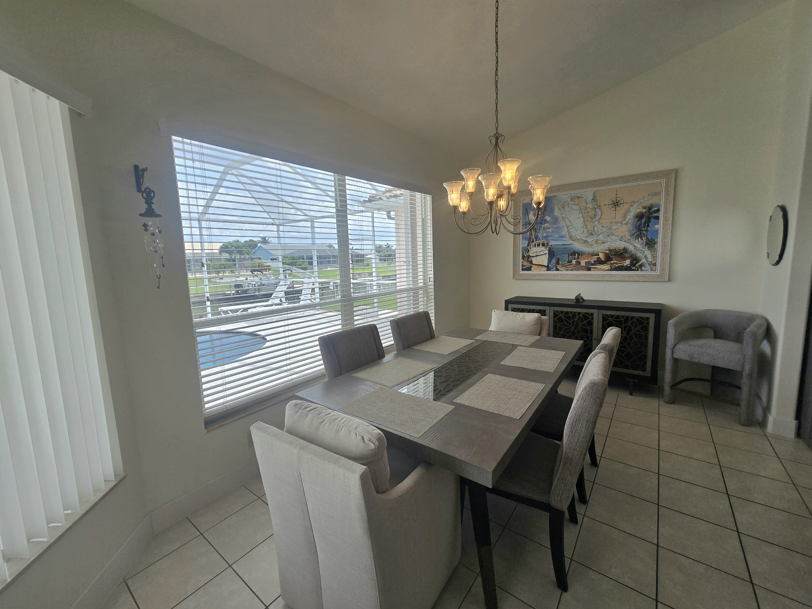 Dining area seats up to 6, offering stunning views of the water, pool, and lanai area!