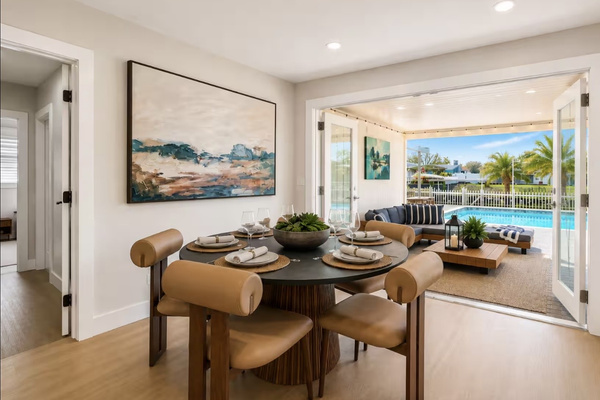 Dining area with beautiful waterfront views and abundant natural light