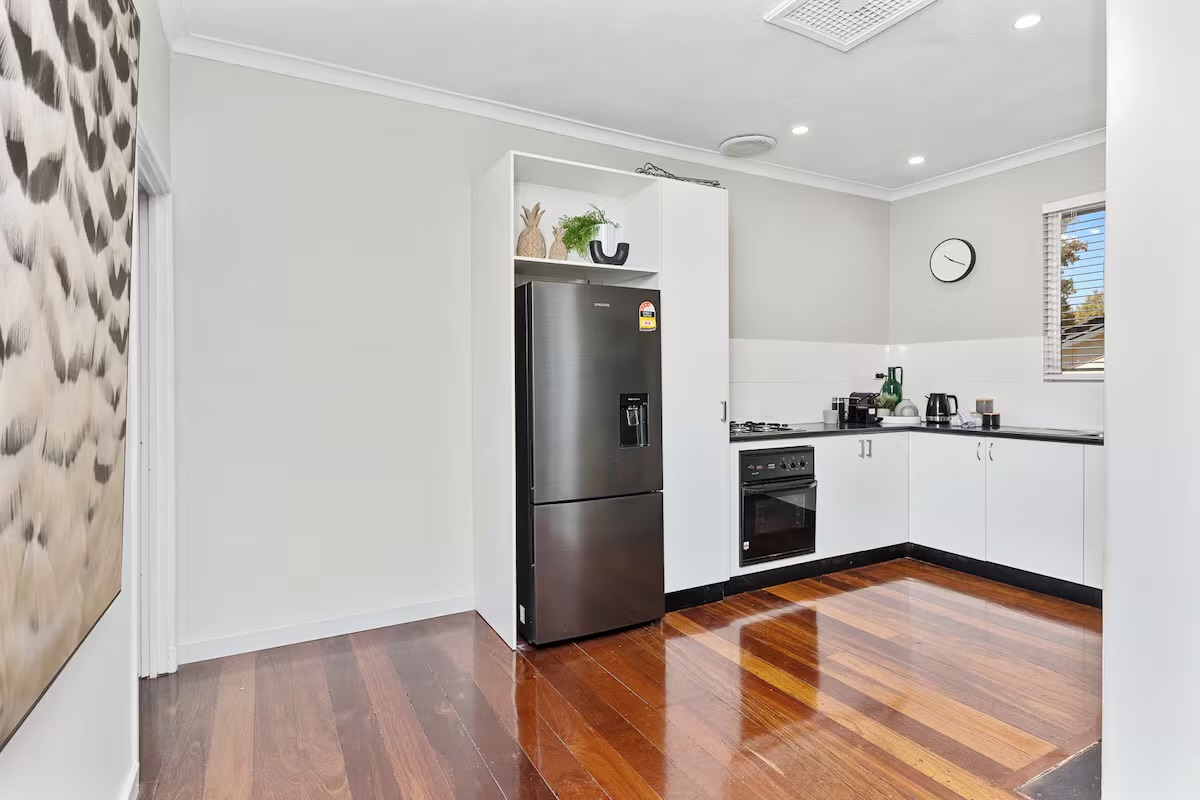 A full-size fridge/freezer with water dispenser adds premium everyday convenience to the kitchen at Sasha’s Cottage on the Hill.