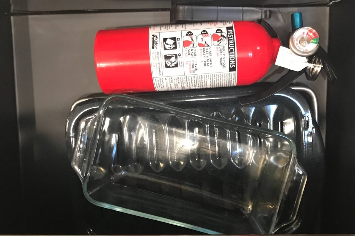 bakeware, loaf pan, pie plate and fire extinguisher.