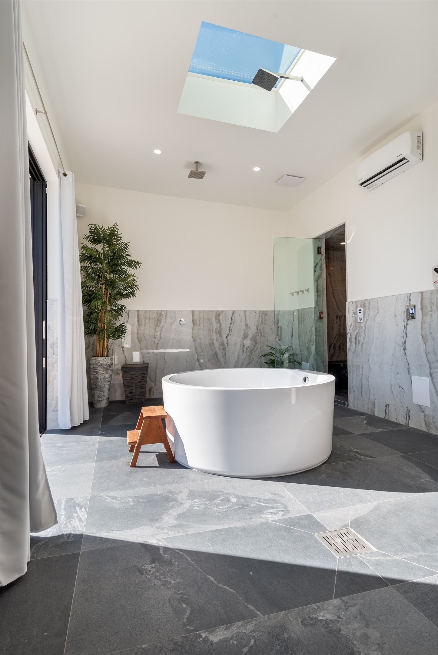 Private spa lounge - Soaking tub with skylight tub filler, cedar dry sauna and steam room