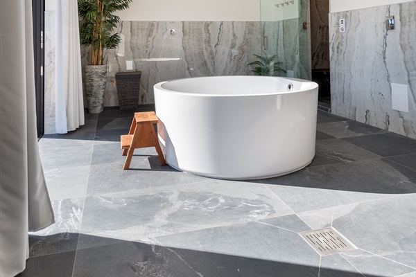 Private spa lounge - Soaking tub with skylight tub filler, cedar dry sauna and steam room