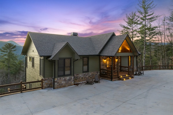 A welcoming front view of the chalet, complete with ample parking and a charming entrance.