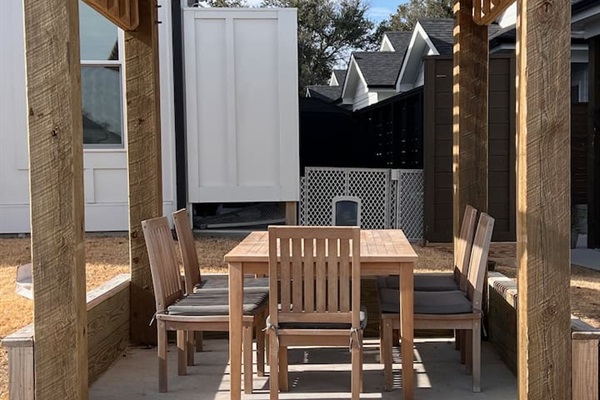 Community outdoor table and chairs located directly across from our unit