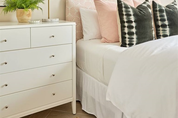 Enjoy a restful nights sleep in a lovely Queen bedroom featuring an award winning premium Winkbed mattress, cozy down comforter and pillows, 800-thread-count linens, a nice size closet and dresser, and a smart TV overlooking the private patio.