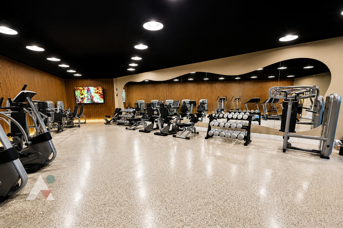 The fitness center on the mezzanine level offers cardio machines, free weights and strength equipment.