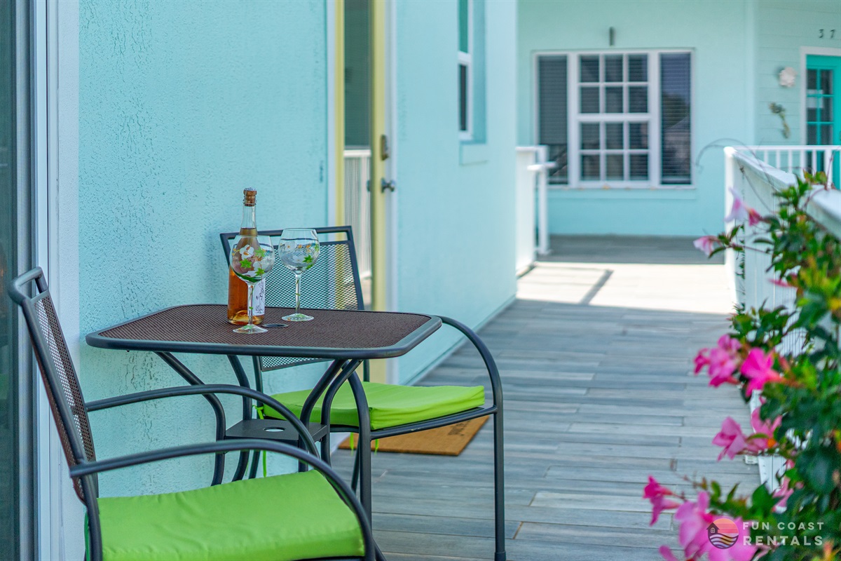 Quaint balcony overlooking community courtyard with shops and restaurants!