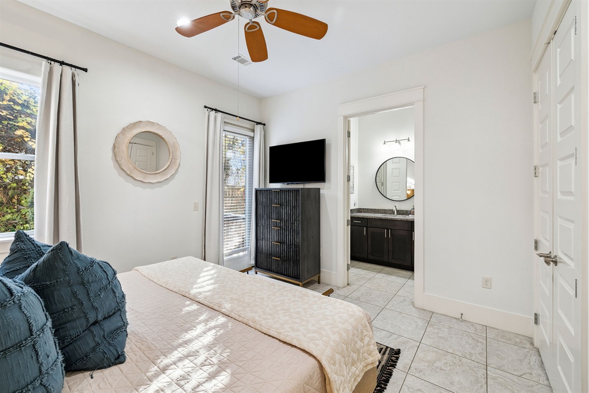Bright, airy, and thoughtfully decorated, this bedroom with an ensuite bathroom provides a relaxing escape from the everyday.