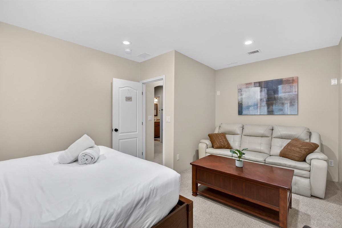 Spacious basement bedroom layout creates a relaxed private sleeping space away from main living areas