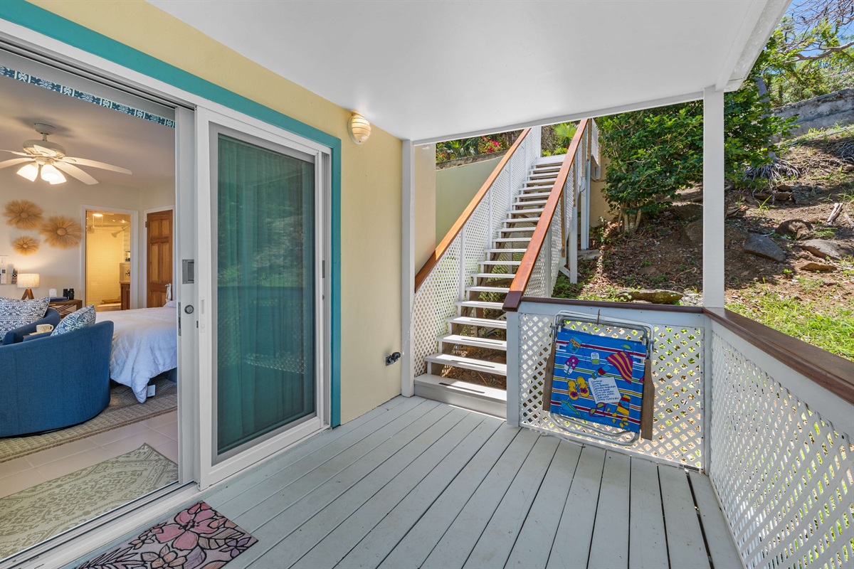 Down a set of stairs from the parking area to your apartment. Two beach chairs are provided.