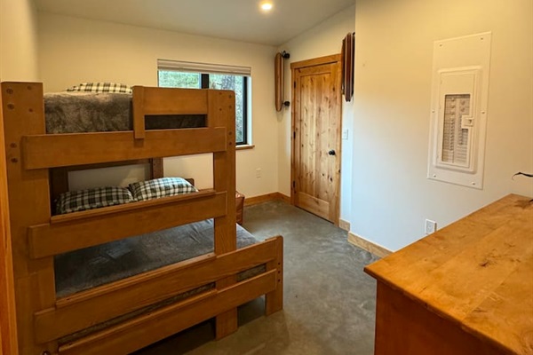 Guest bedroom with twin over full bunkbed and room darkening shades