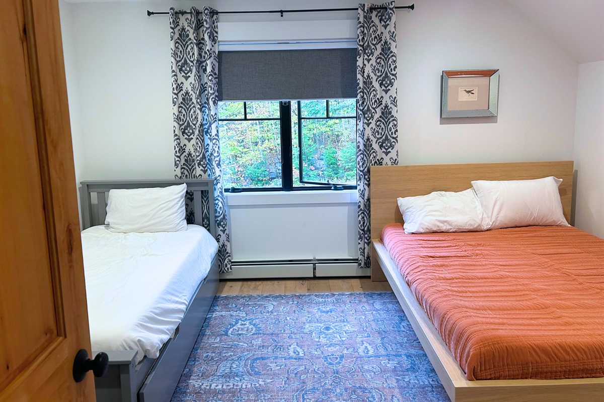 Find focus and relaxation in our versatile office space, complete with a functional desk and a cozy day bed for moments of rest