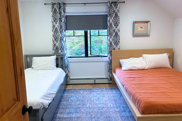 Find focus and relaxation in our versatile office space, complete with a functional desk and a cozy day bed for moments of rest