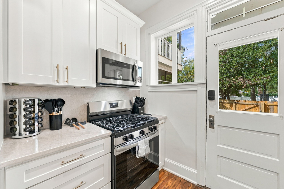 Kitchen: Cook up a storm in this stylish space with modern appliances and cheerful light!