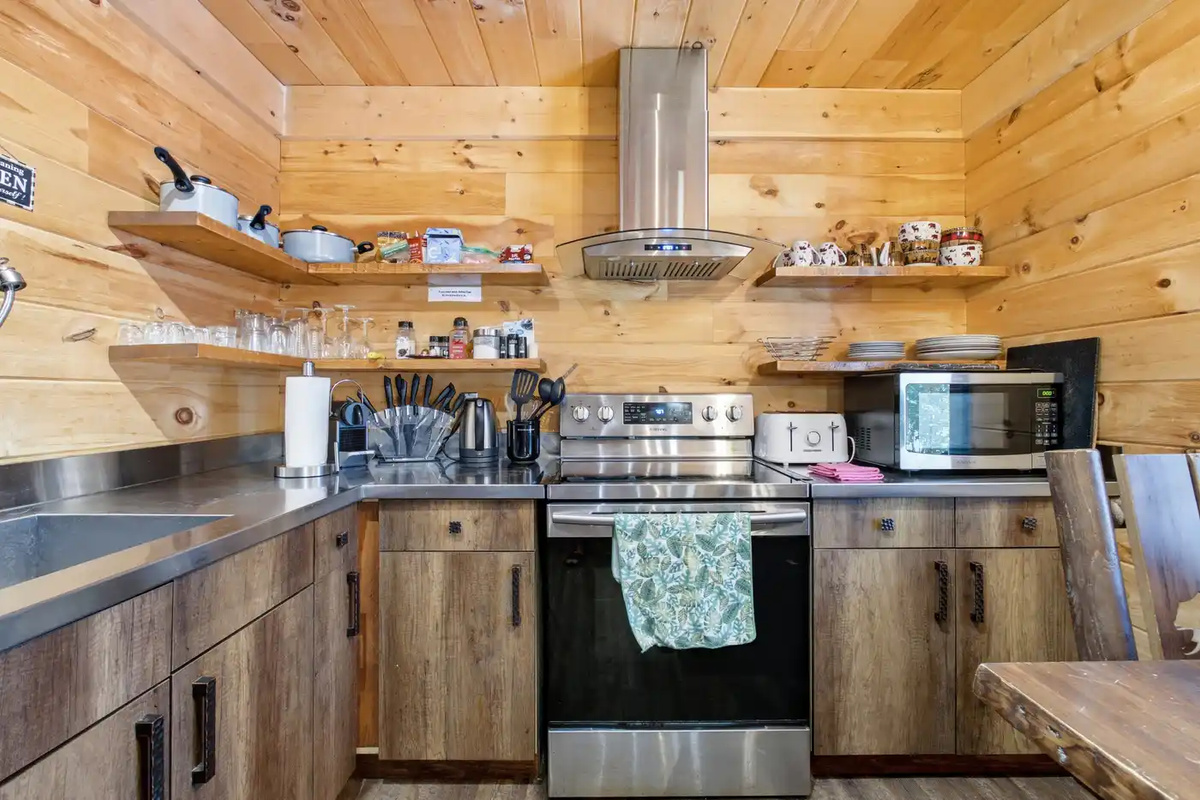 Fully equipped kitchen with stove, sink and generous counter space