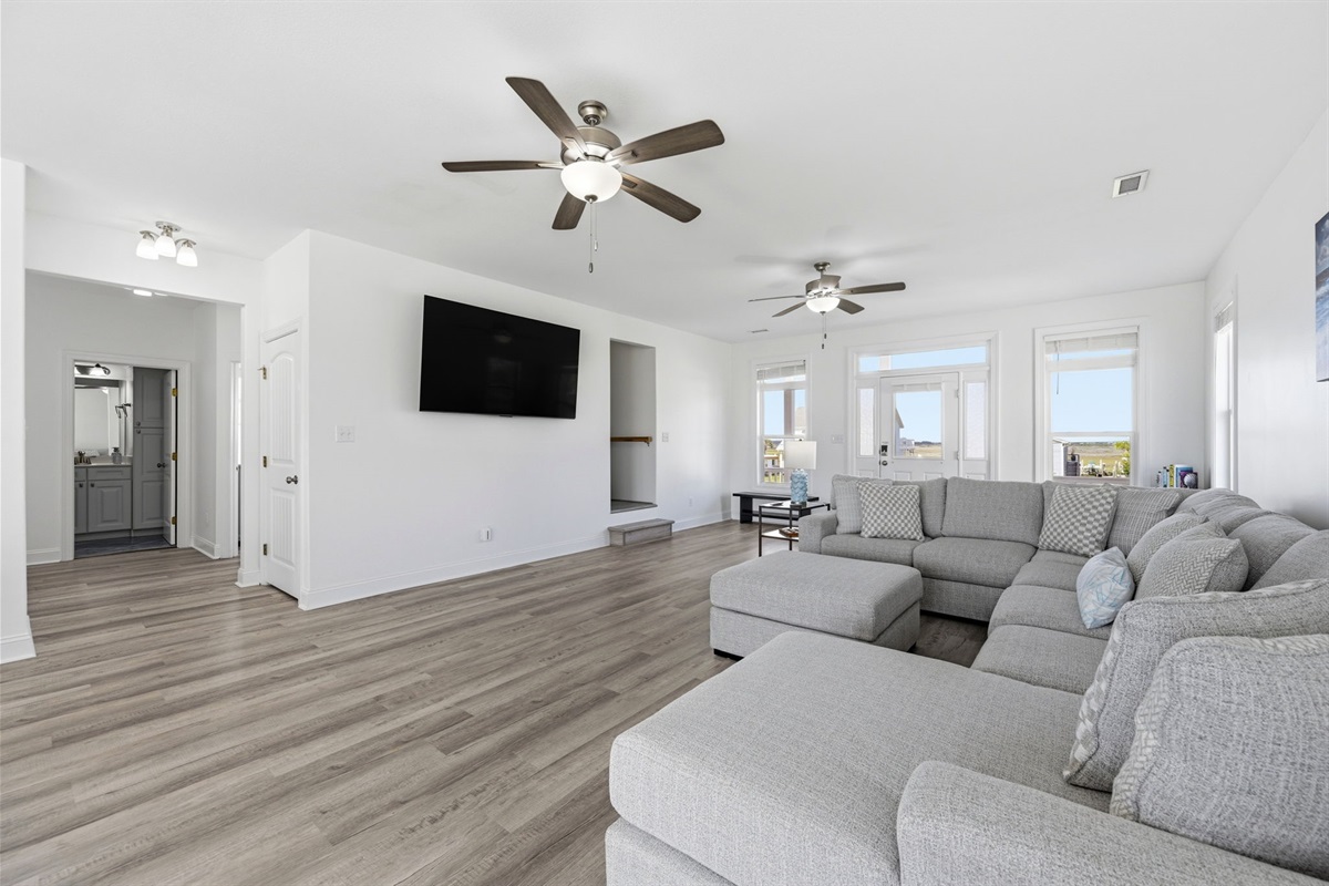 Stretch out, settle in, and enjoy effortless coastal living in this open-concept space