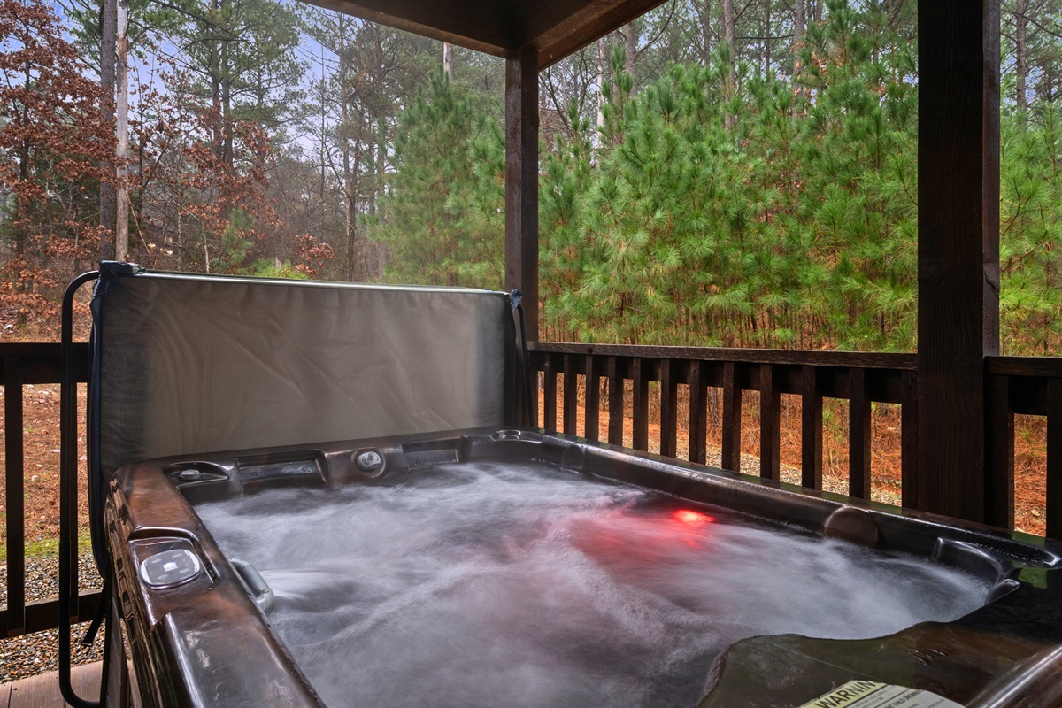 The private hot tub is tucked among the pines, creating a quiet, relaxing spot to unwind any time of day or night.