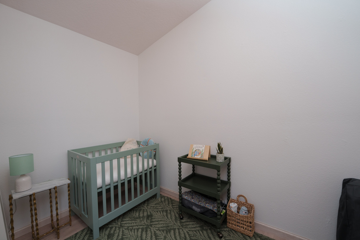 A dedicated nursery connected to Bedroom 4 offers a cozy, convenient space for little ones, complete with a crib and room for bedtime essentials.
