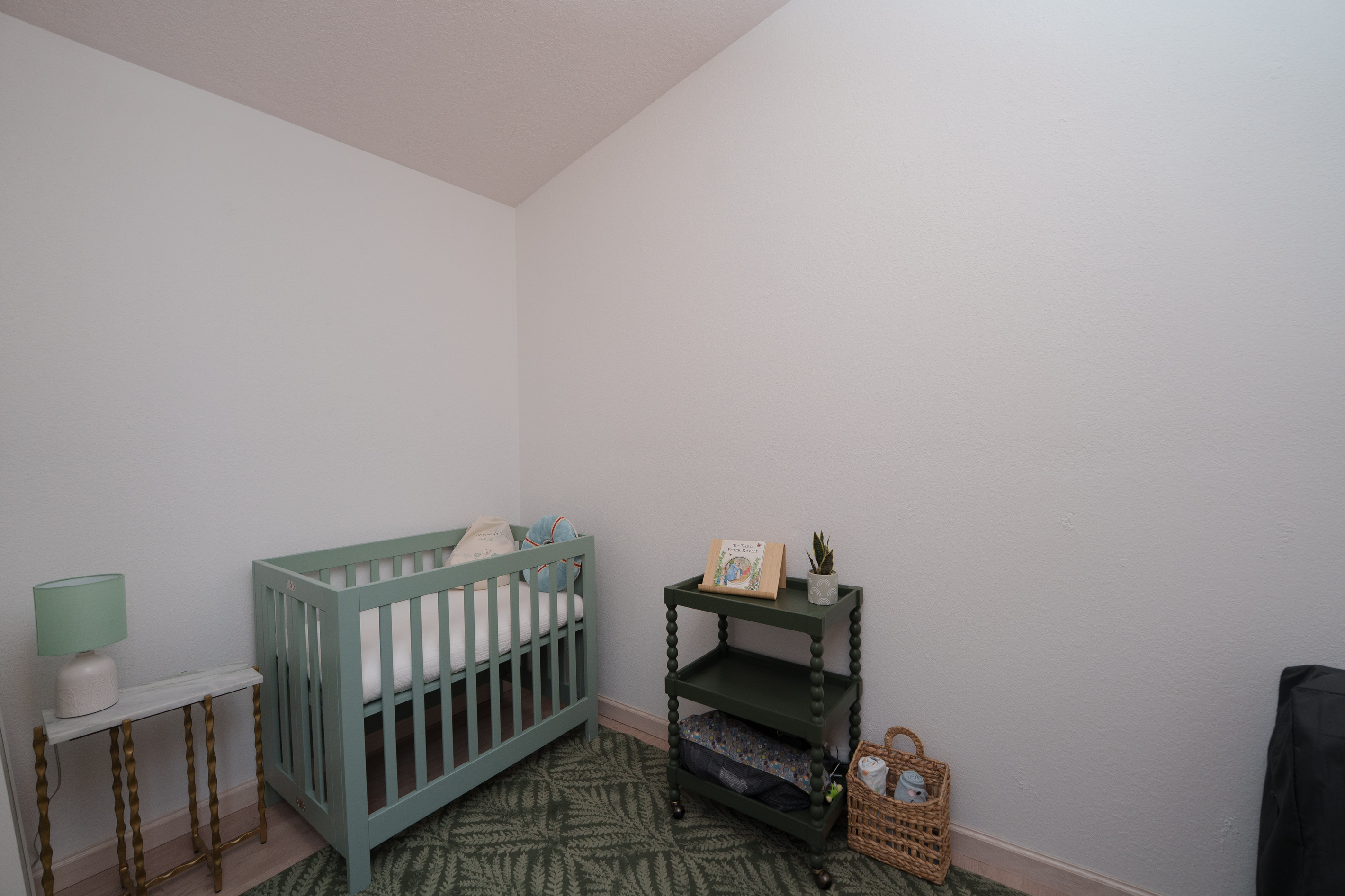 A dedicated nursery connected to Bedroom 4 offers a cozy, convenient space for little ones, complete with a crib and room for bedtime essentials.