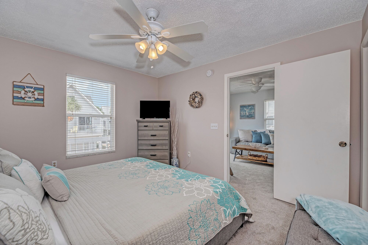 Primary bedroom with attached full bath and walk in closet. Enjoy a restful night on our king bed with lux mattress (a Purple mattress!). 