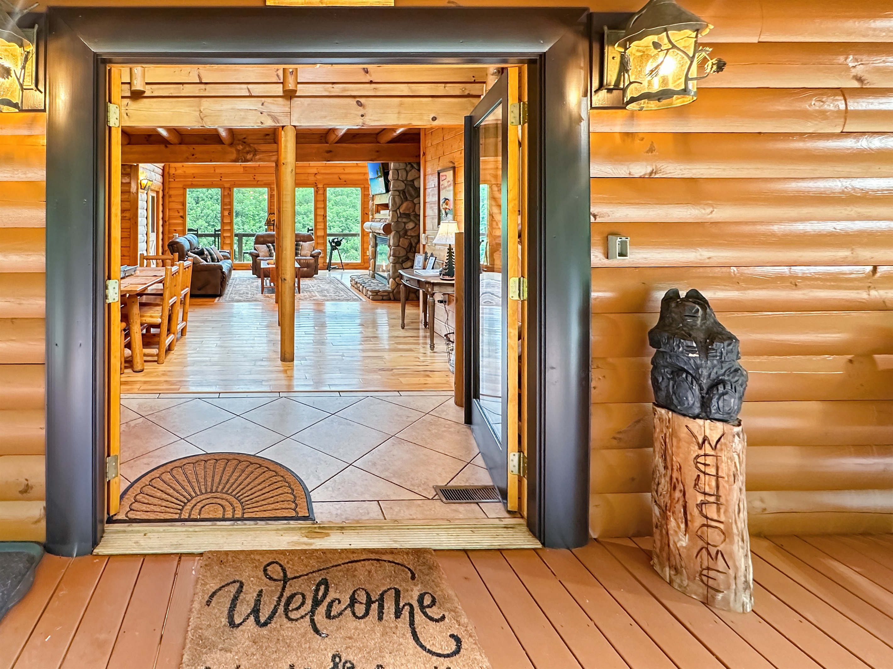Entryway:Step into nature's embrace with stunning views and warm, inviting decor!