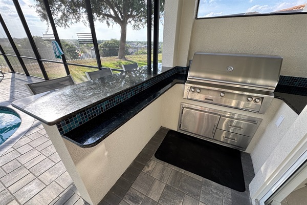 Outdoor kitchen and bar area