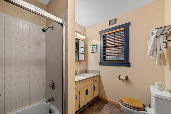 Convenient second upper-level bathroom. Featuring a traditional tub/shower combo and a wide vanity layout, it ensures everyone has plenty of space to get ready for the day.