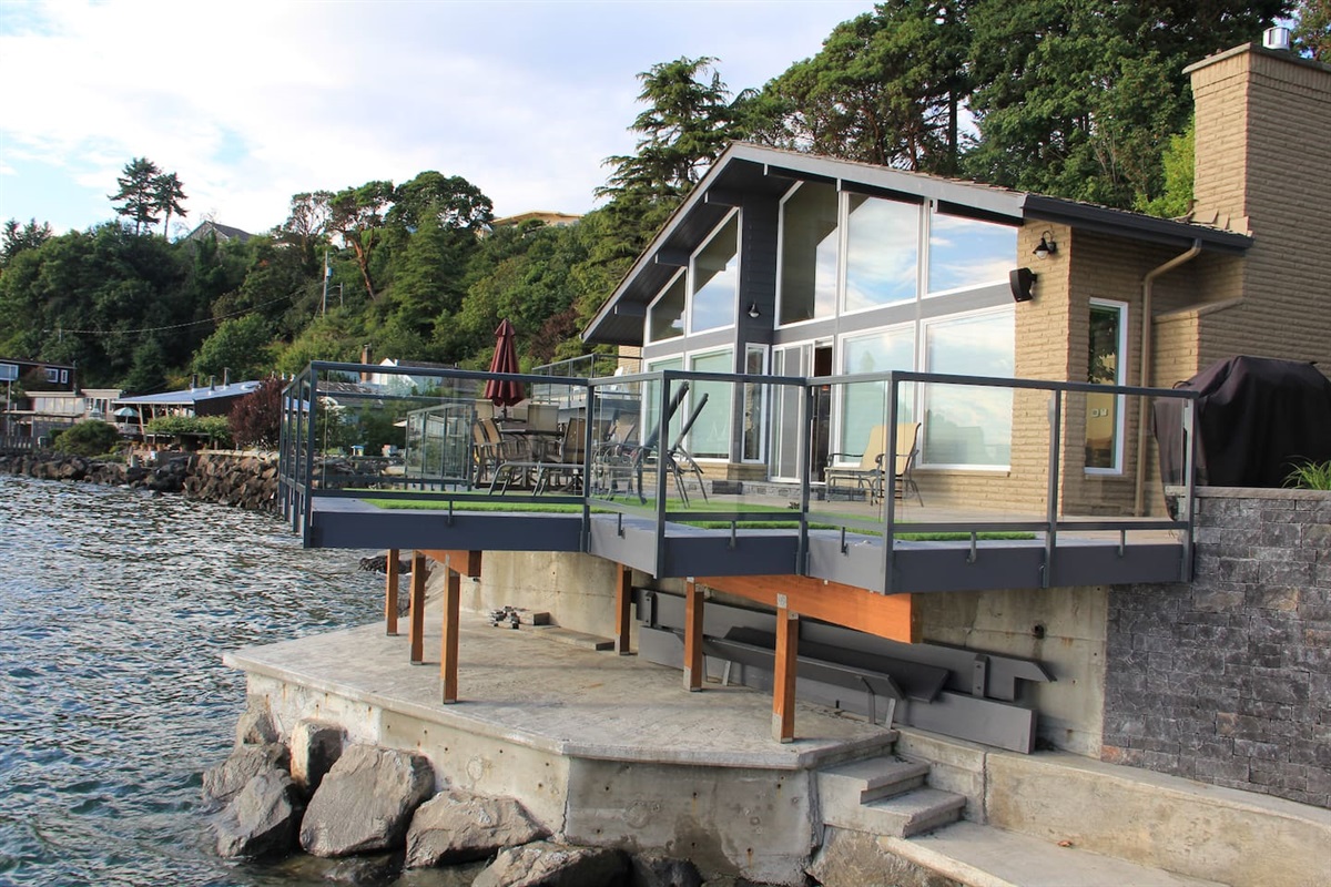 125' of waterfront, beach and patio will make this one of the most memorable vacation homes ever!