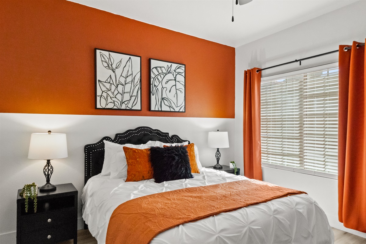 Sink into a comfortable quuen-size bed with premium linens, plush pillows, and a peaceful bedroom designed for a restful night's sleep.